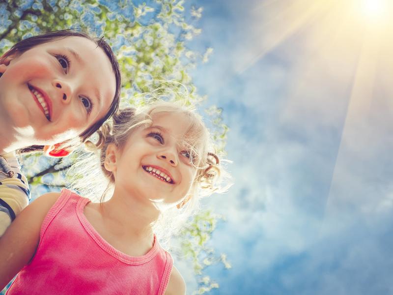 Two children smiling