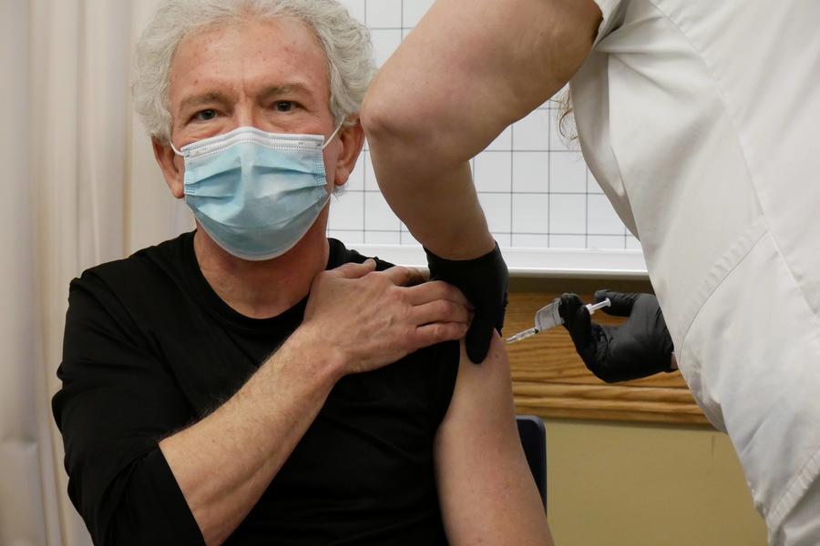 Hospital worker getting COVID vaccine