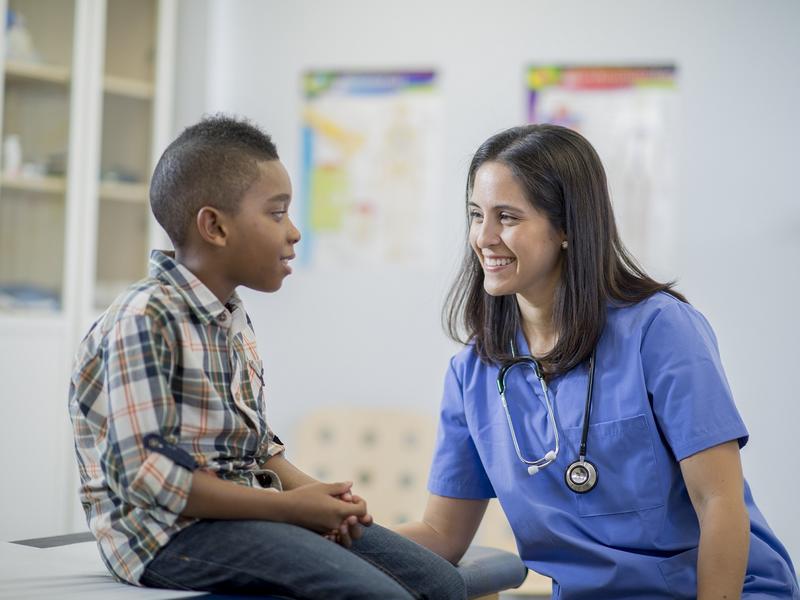 Nurse talking with child