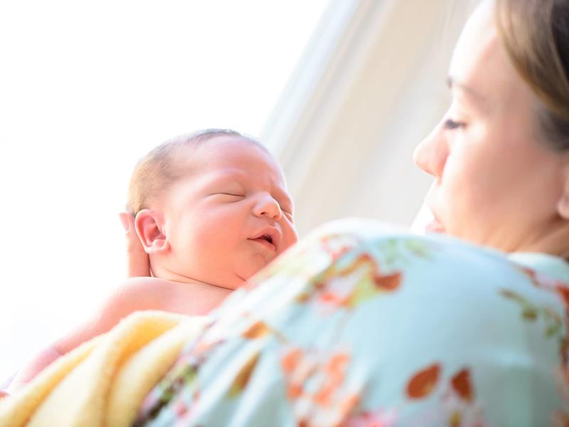 Mother looking at newborn baby