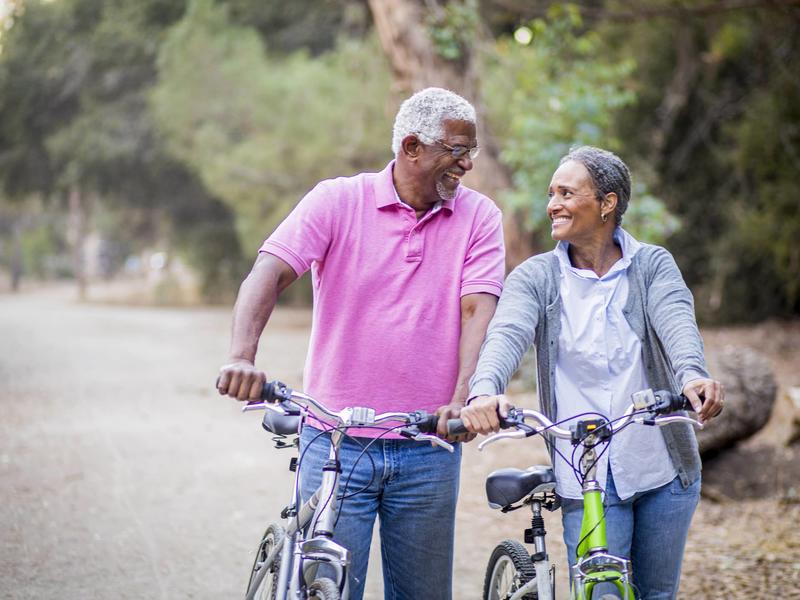 Couple walking with bicycles 