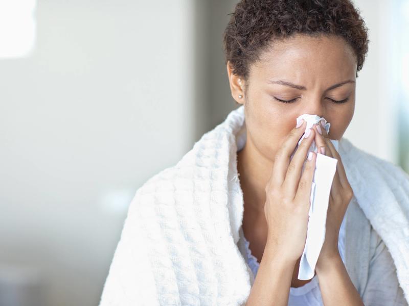 woman blowing her nose